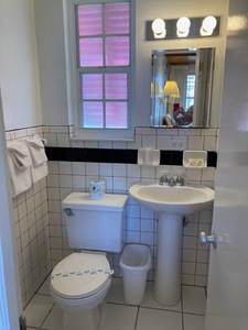 Small, tile bathroom with sink