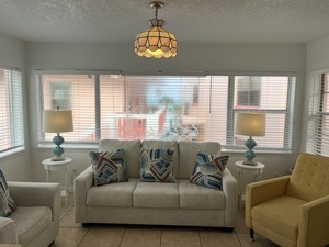 Room 35 Living Room with Ocean View and Brightly Colored Sofa