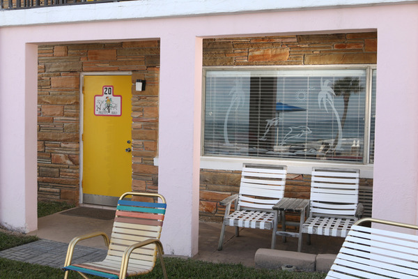 private patio facing pool and ocean