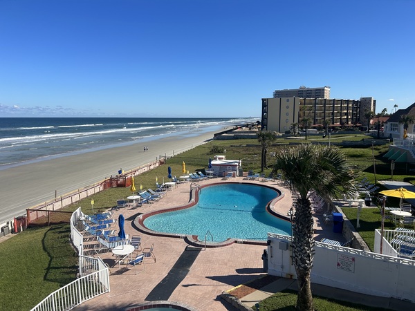 View of ocean and pool from walkway outside Room 32